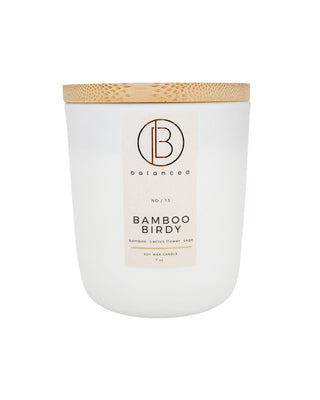 Essential oil infused. 100% soy wax candle with engraved bamboo lid in a white glass jar